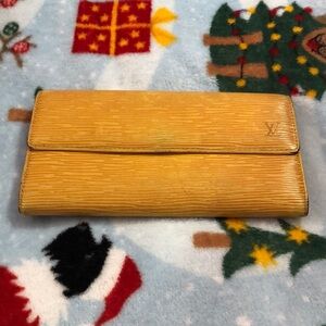 Louis Vuitton Yellow Wallet with Leather Texture and Flap Closure Authenic